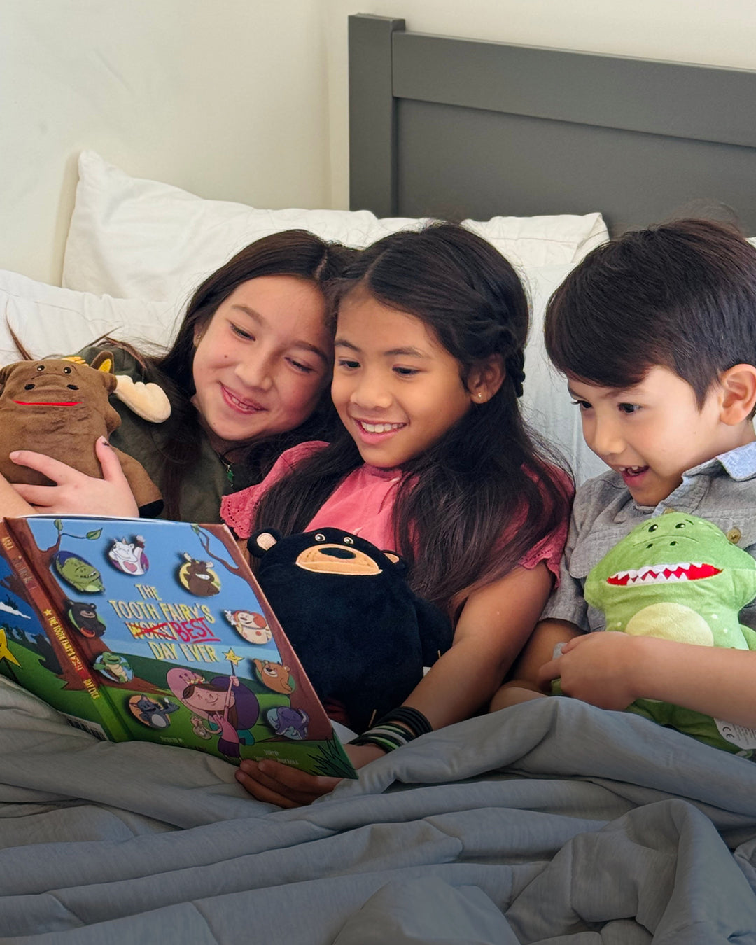 Kids with book and plush